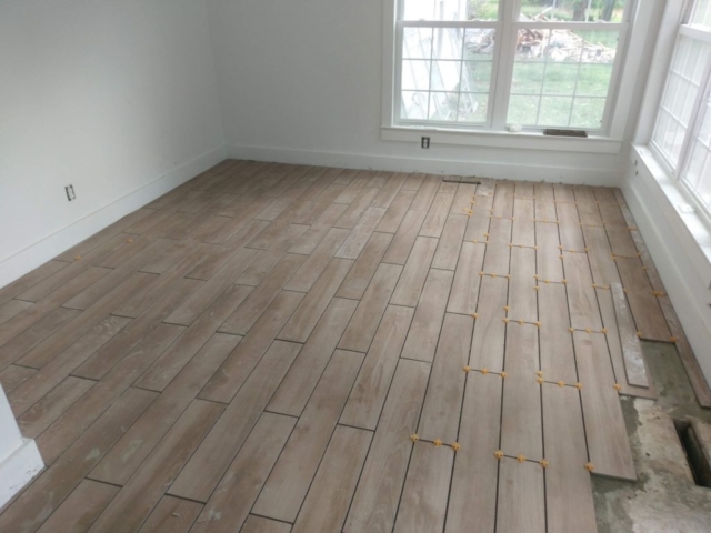 Faux Wood Tile Plank Floor During Construction