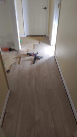 Water Damaged Hall Flooring During New Floor Install