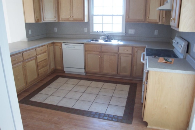 Tile Rug Embedded into Wooden Floor